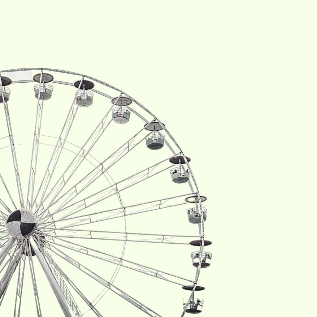 digital art project idea: black and white picture on a colorful background. This one features a black and white ferris wheel on a greenish almost white background.