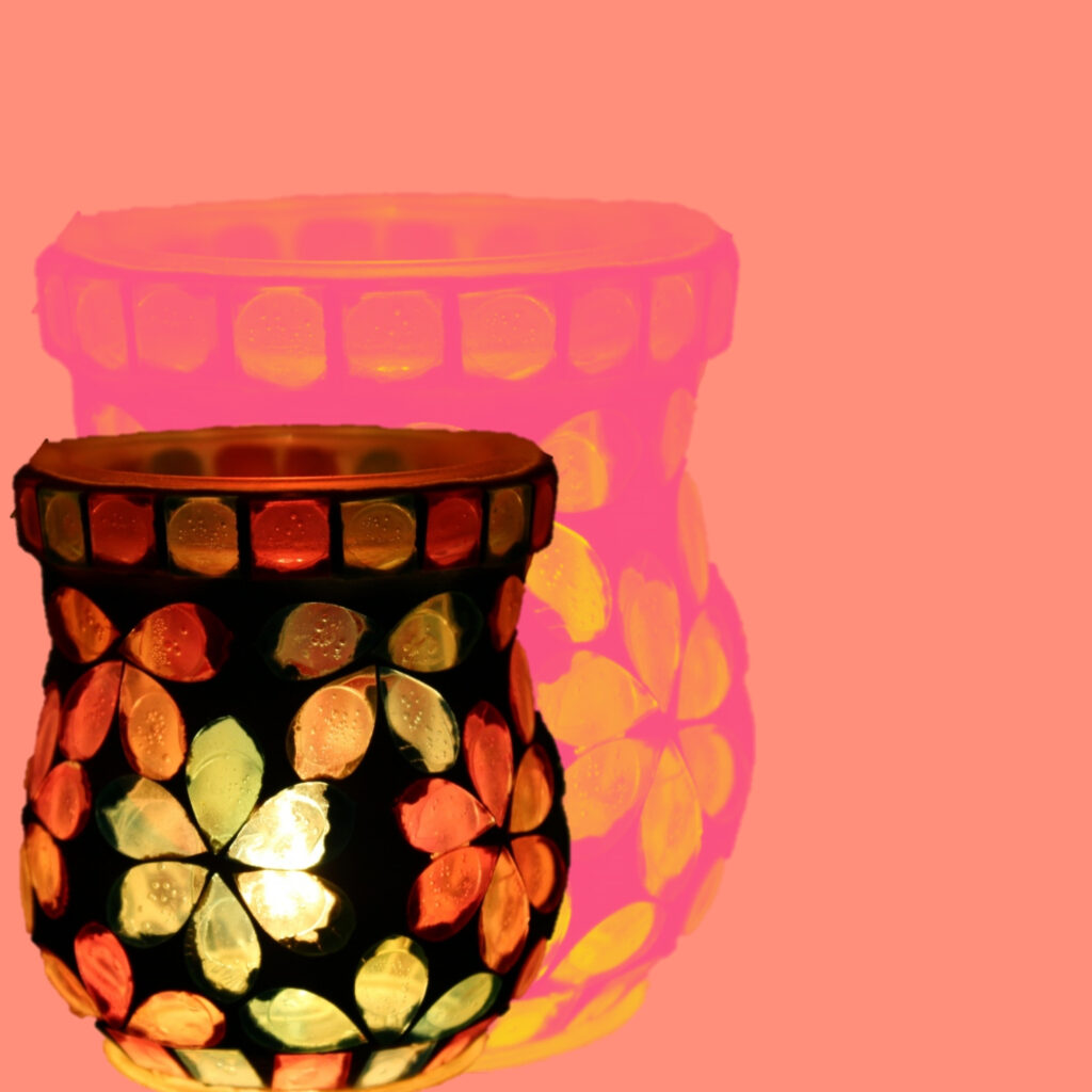 Lit votive and coral
